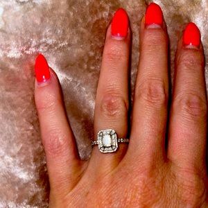 Diamond and white gold halo engagement ring